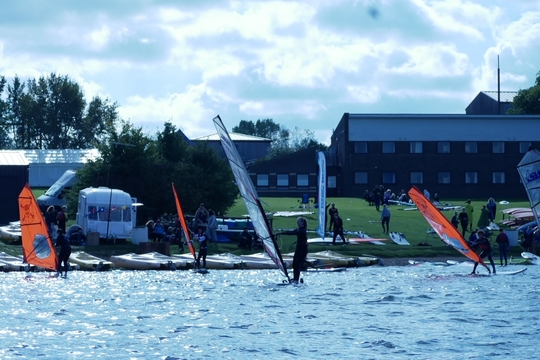 Image of windsurfing on a lake.